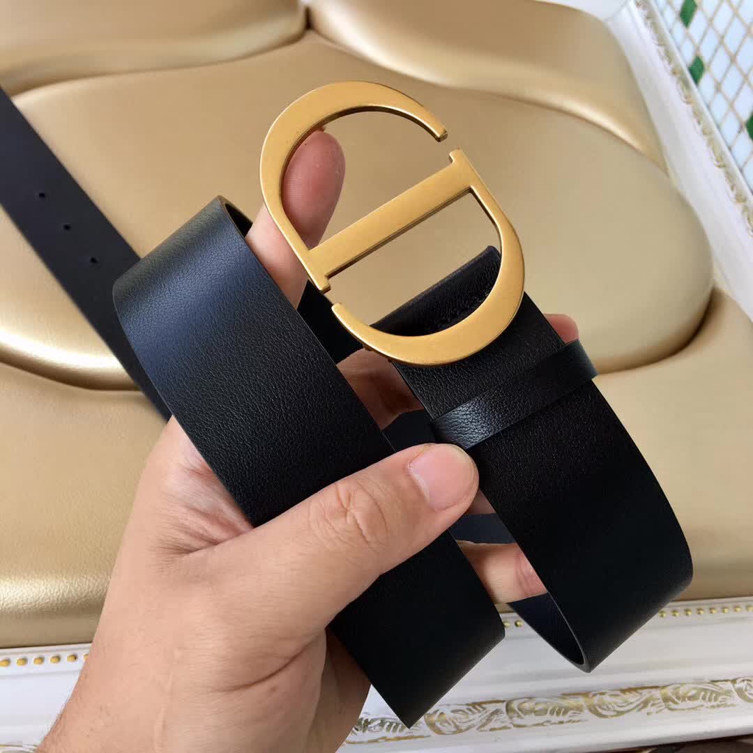 Christian Dior 30 Montaigne belt is crafted from smooth black calfskin and features a signature gold-finish metal "CD" buckle