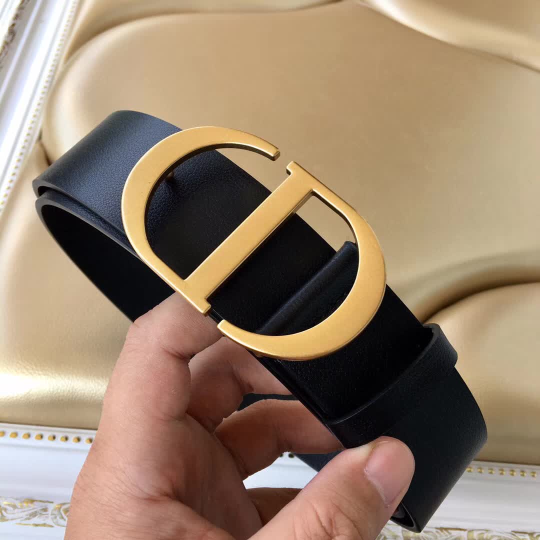 Christian Dior 30 Montaigne belt is crafted from smooth black calfskin and features a signature gold-finish metal "CD" buckle