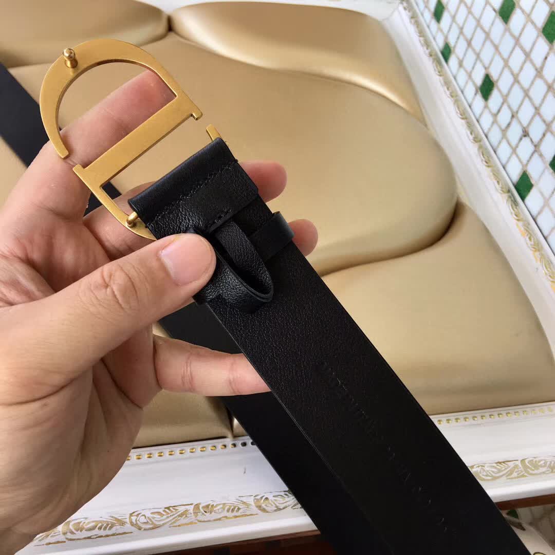 Christian Dior 30 Montaigne belt is crafted from smooth black calfskin and features a signature gold-finish metal "CD" buckle