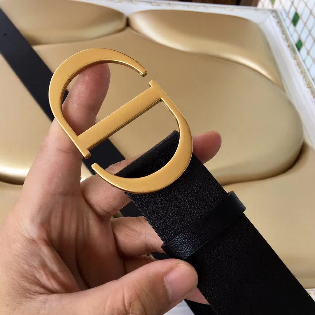 Christian Dior 30 Montaigne belt is crafted from smooth black calfskin and features a signature gold-finish metal "CD" buckle