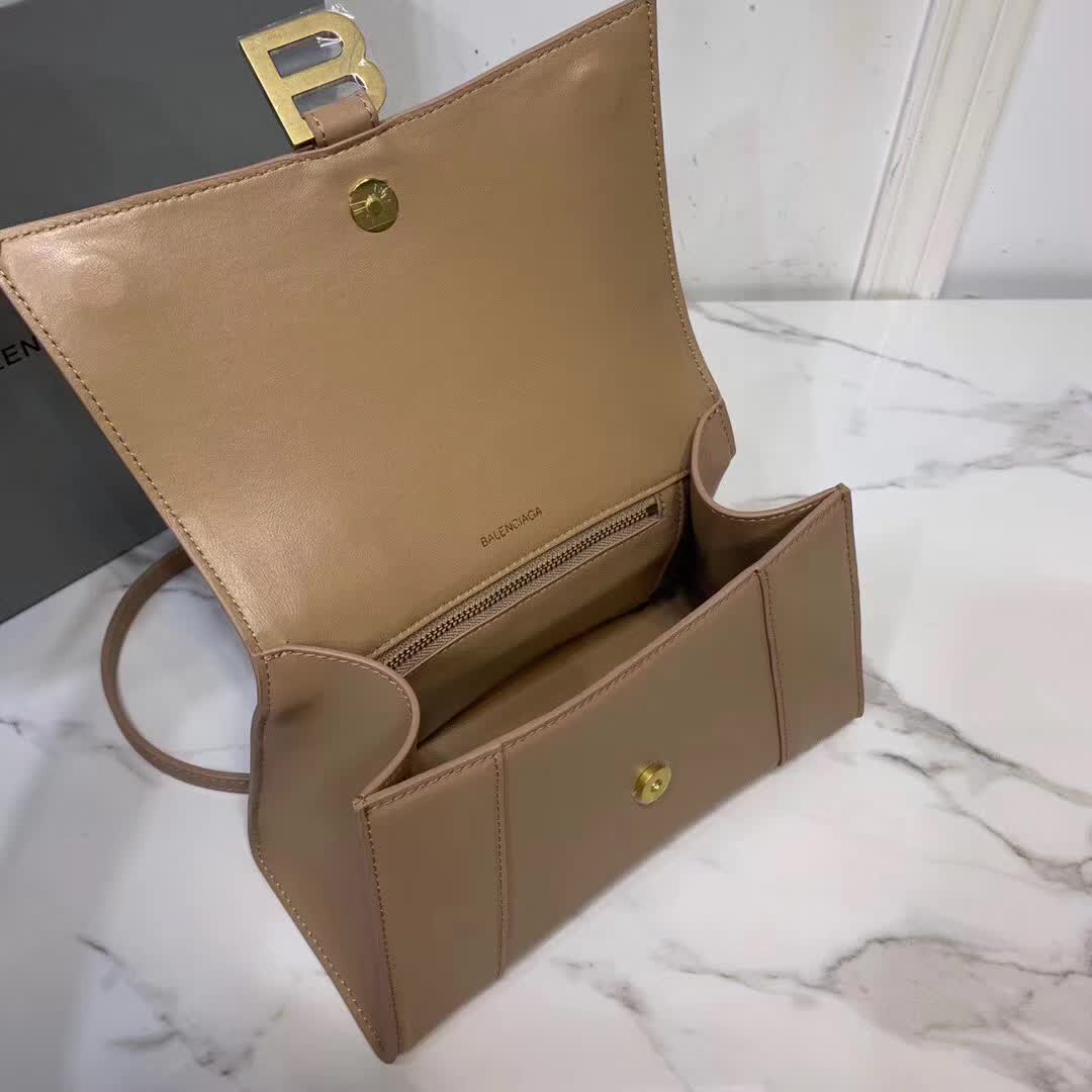 Balenciaga Hourglass small top handle bag in a brown hue