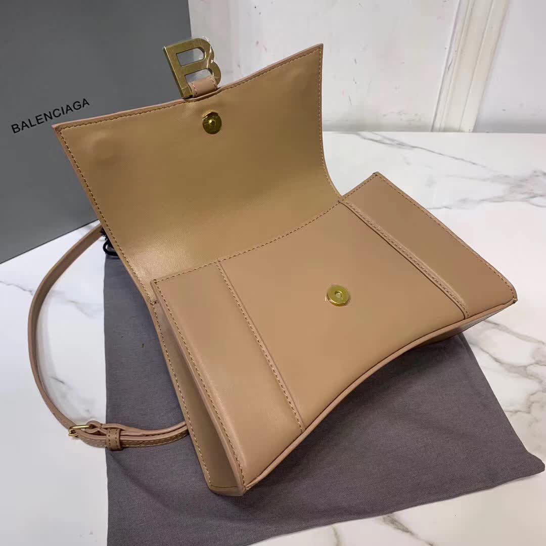 Balenciaga Hourglass small top handle bag in a brown hue
