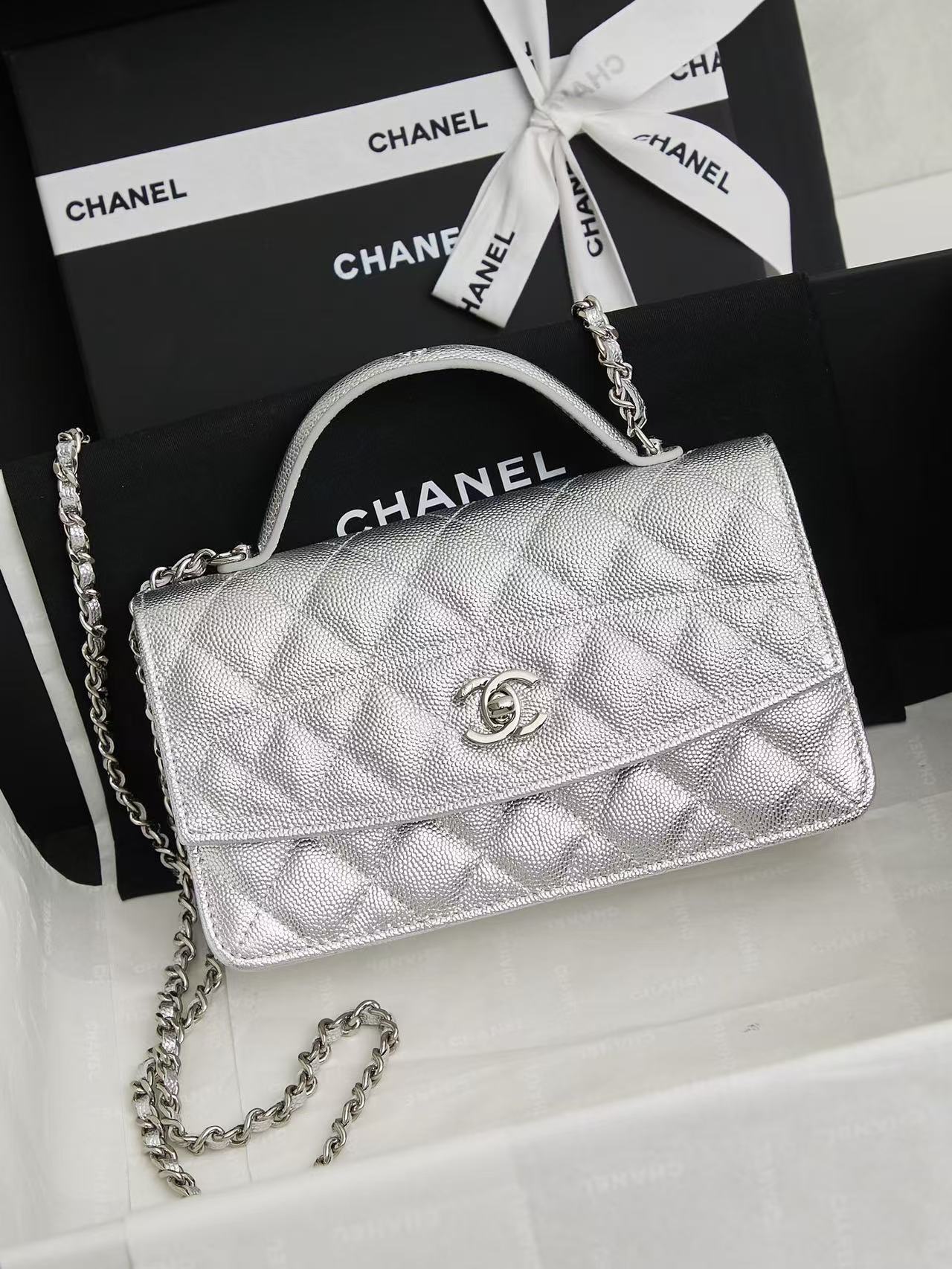 Chanel Coco Handle bag a structured classic crafted in quilted leather featuring a top handle and iconic CC turn-lock