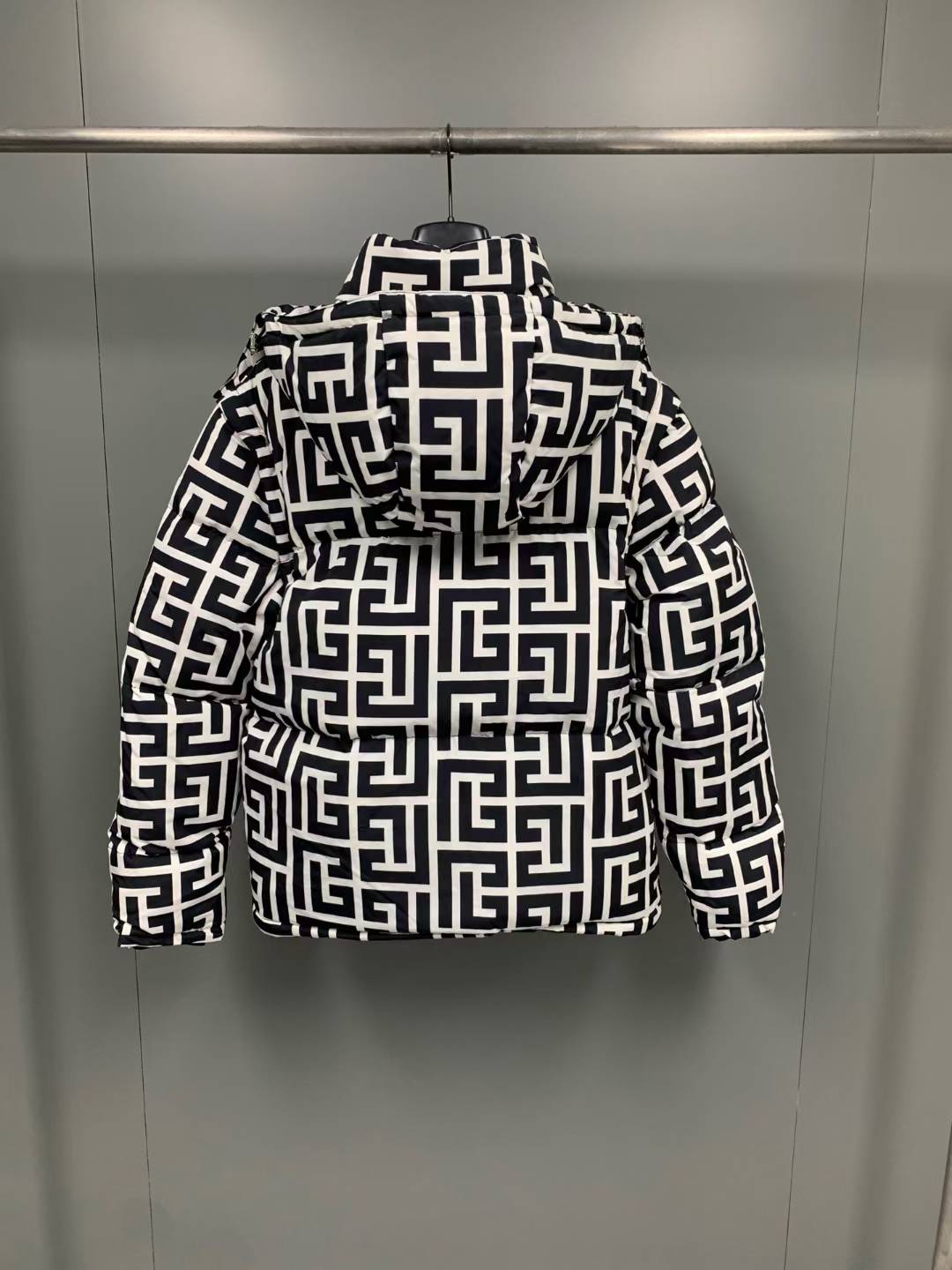 Balmain Maxi Monogram Quilted Jacket, a versatile luxury piece featuring detachable sleeves that allow it to be worn as a vest.