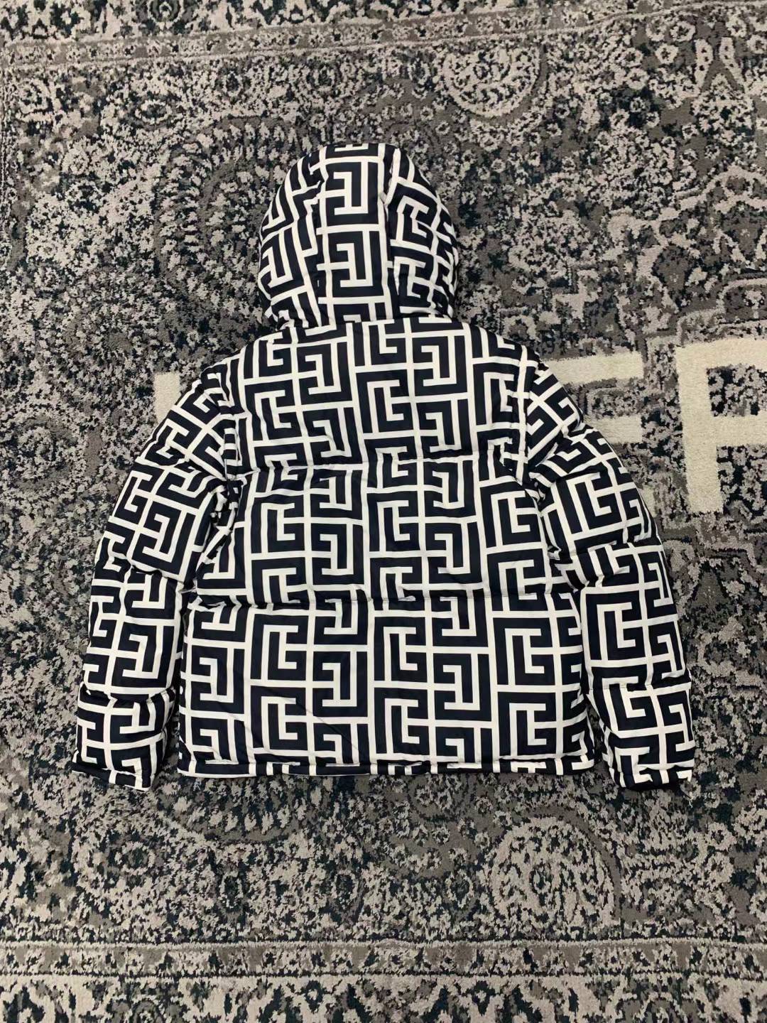 Balmain Maxi Monogram Quilted Jacket, a versatile luxury piece featuring detachable sleeves that allow it to be worn as a vest.