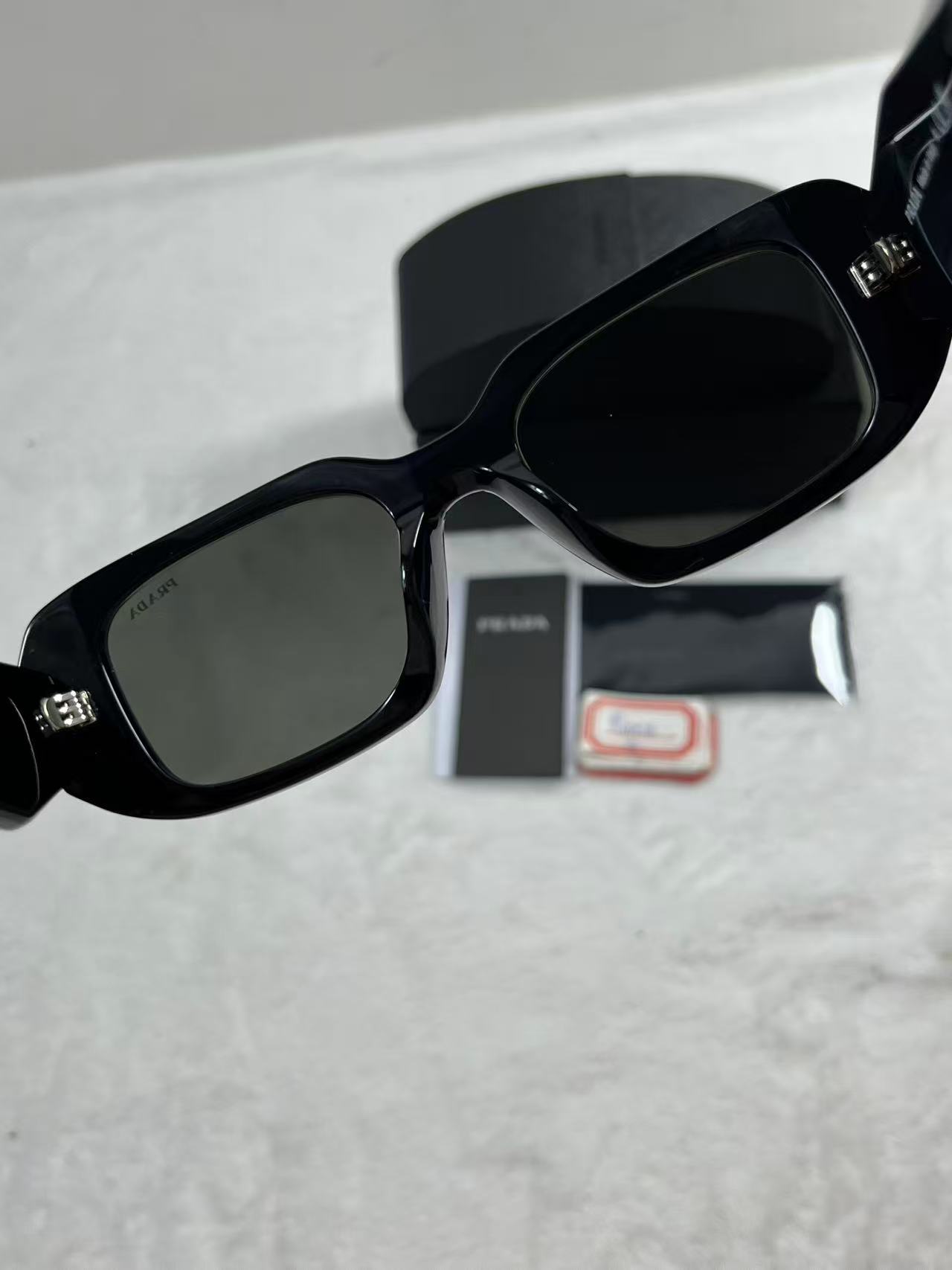 Prada Eyewear logo-lettering Rectangular Sunglasses Black