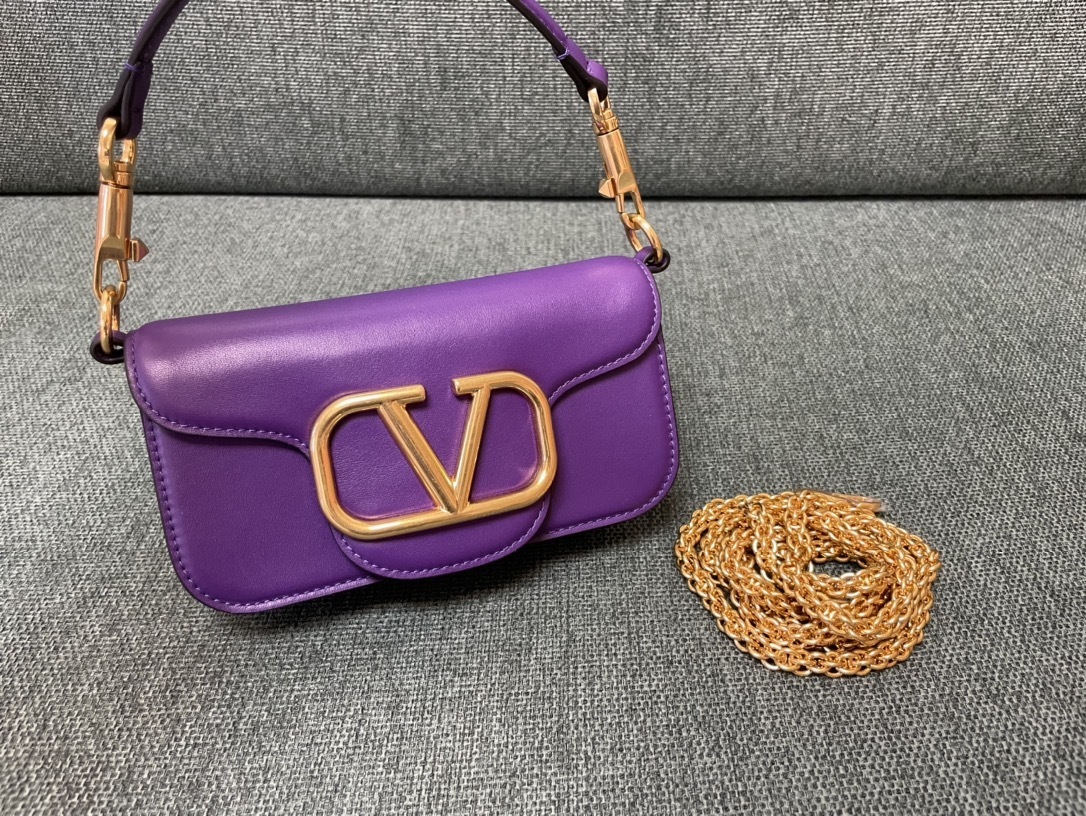 Valentino Garavani Locò small leather shoulder bag in purple with gold-tone hardware