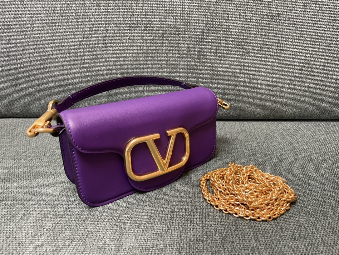 Valentino Garavani Locò small leather shoulder bag in purple with gold-tone hardware