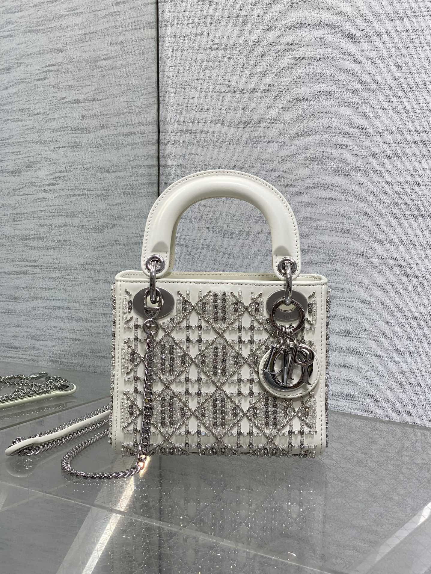Dior Mini Lady Dior bag is crafted latte-colored beaded lambskin with silver rhinestone