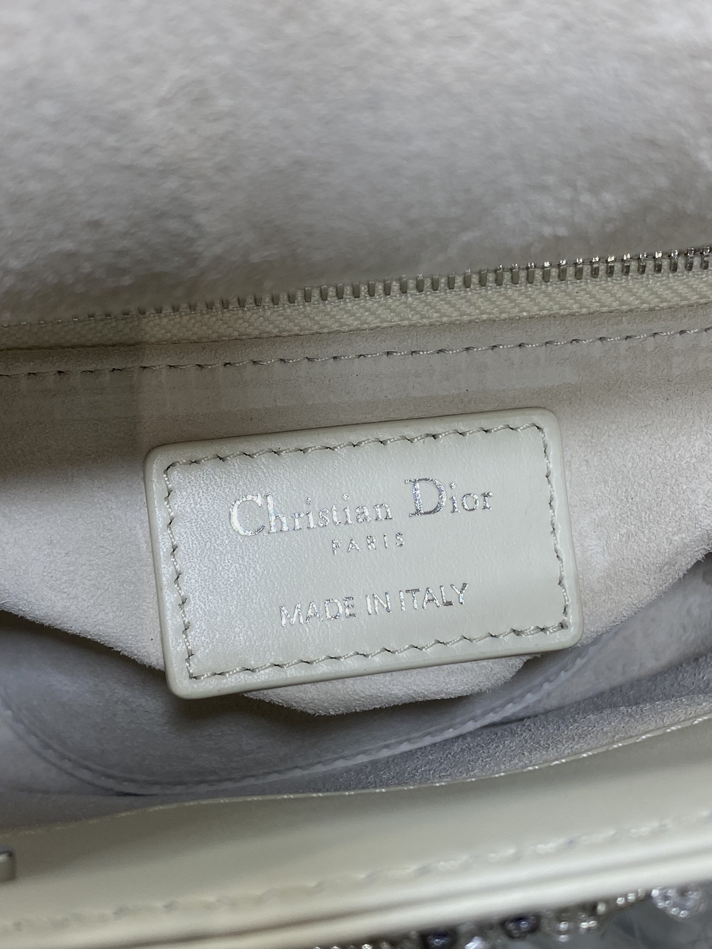 Dior Mini Lady Dior bag is crafted latte-colored beaded lambskin with silver rhinestone