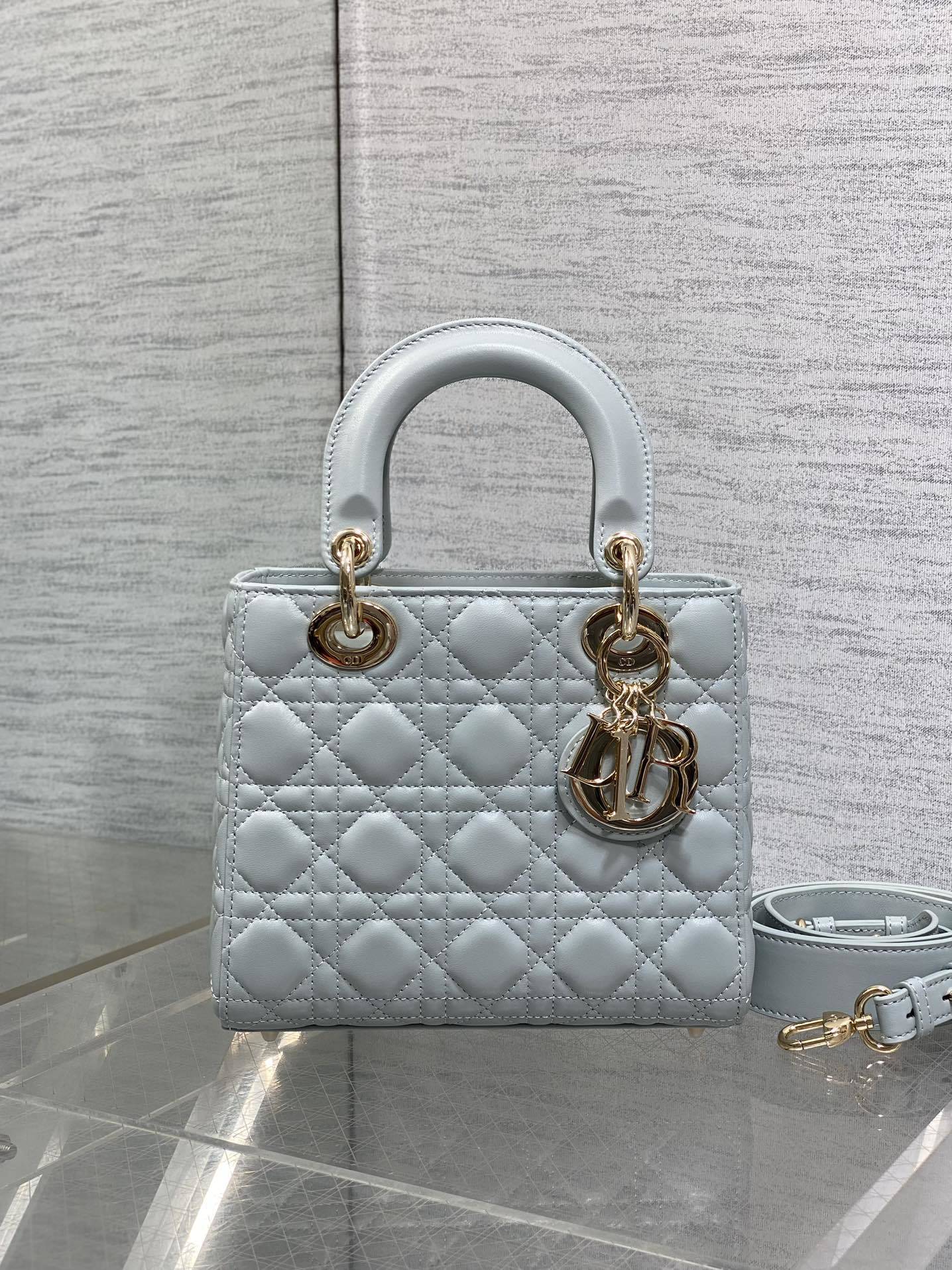 Dior Small Lady Dior My ABCDior Bag typically crafted in cannage lambskin with customizable charms on the strap.