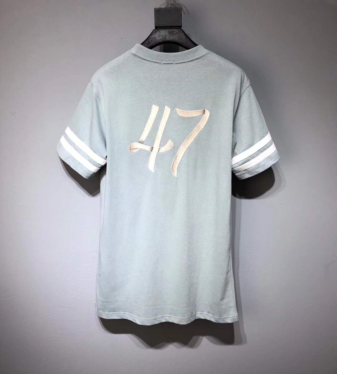 Dior Homme logo light green t-shirt from the Autumn/Winter 2022 collection.