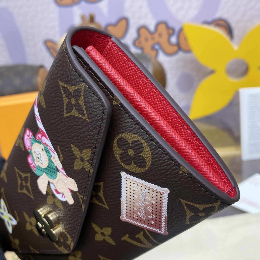 LV Sarah Wallet features the iconic Monogram canvas adorned with the Candy Factory Vivienne mascot and bright printed graphics