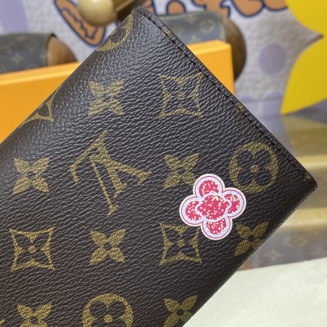 LV Sarah Wallet features the iconic Monogram canvas adorned with the Candy Factory Vivienne mascot and bright printed graphics