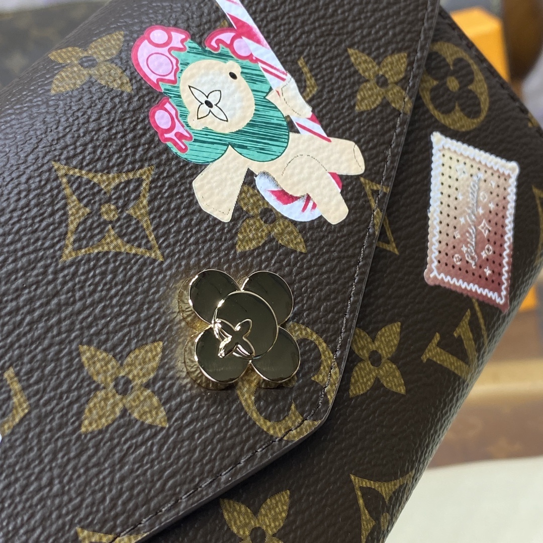 LV Sarah Wallet features the iconic Monogram canvas adorned with the Candy Factory Vivienne mascot and bright printed graphics