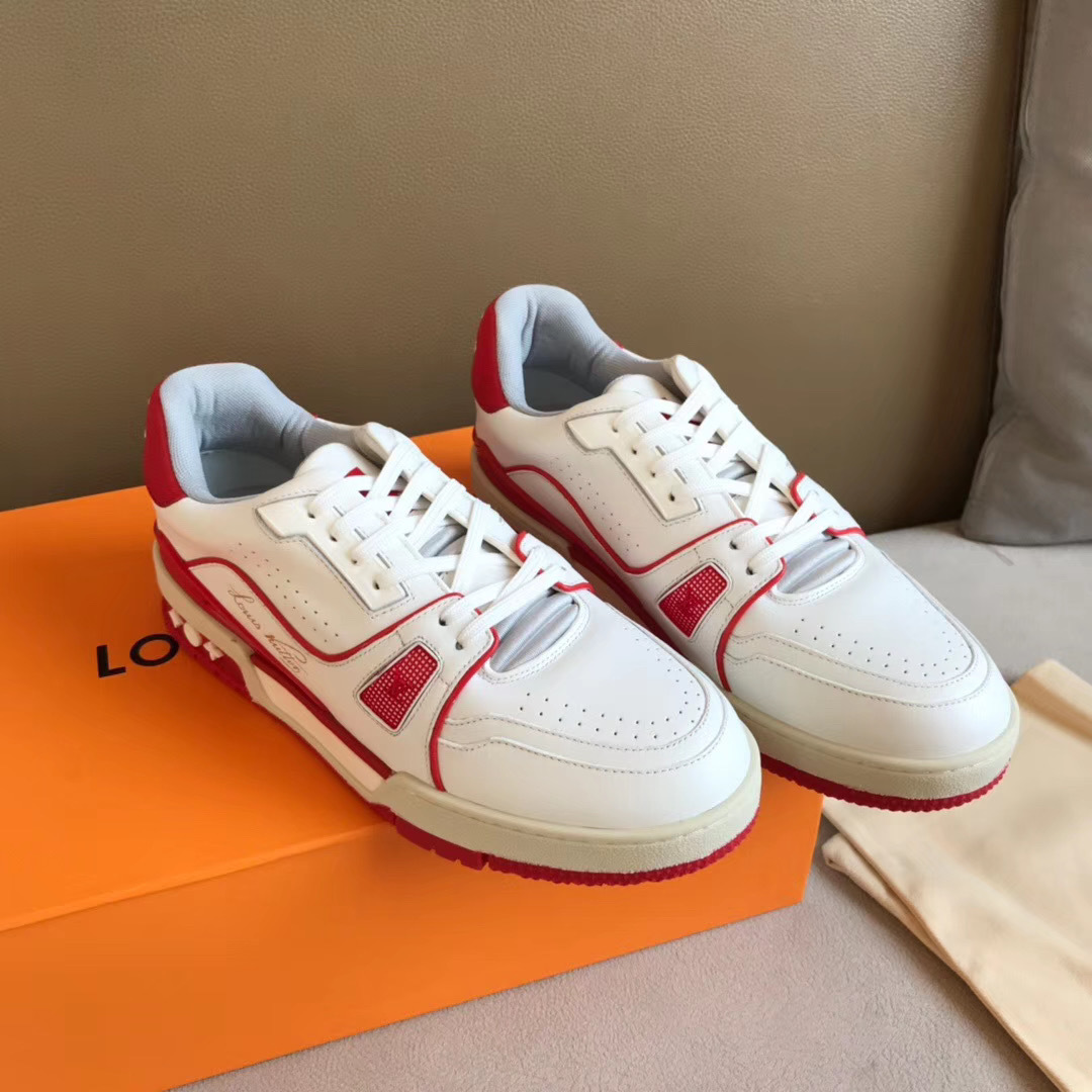 LV Trainer Sneaker in white and red is designed with grained calf leather and features sporty color accents inspired by vintage basketball shoes