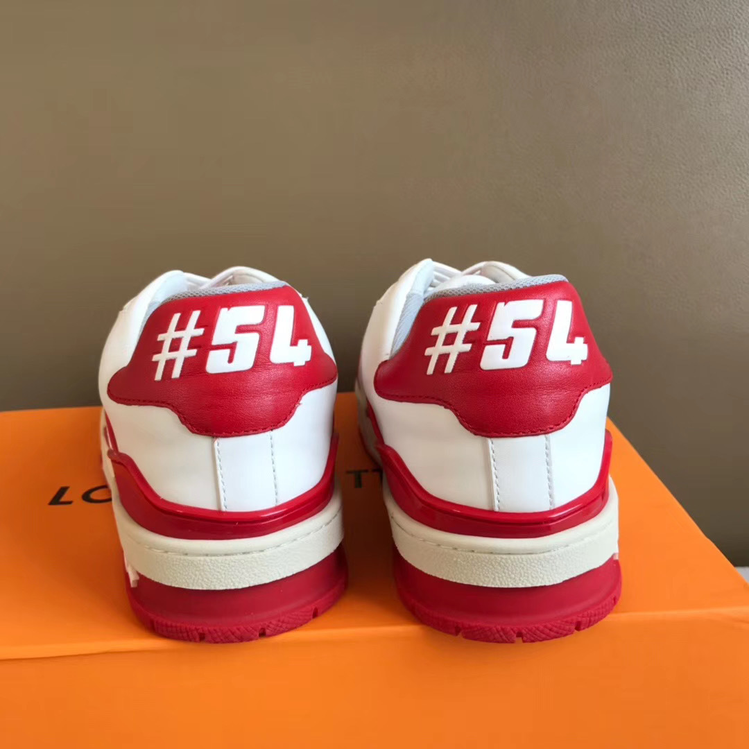 LV Trainer Sneaker in white and red is designed with grained calf leather and features sporty color accents inspired by vintage basketball shoes