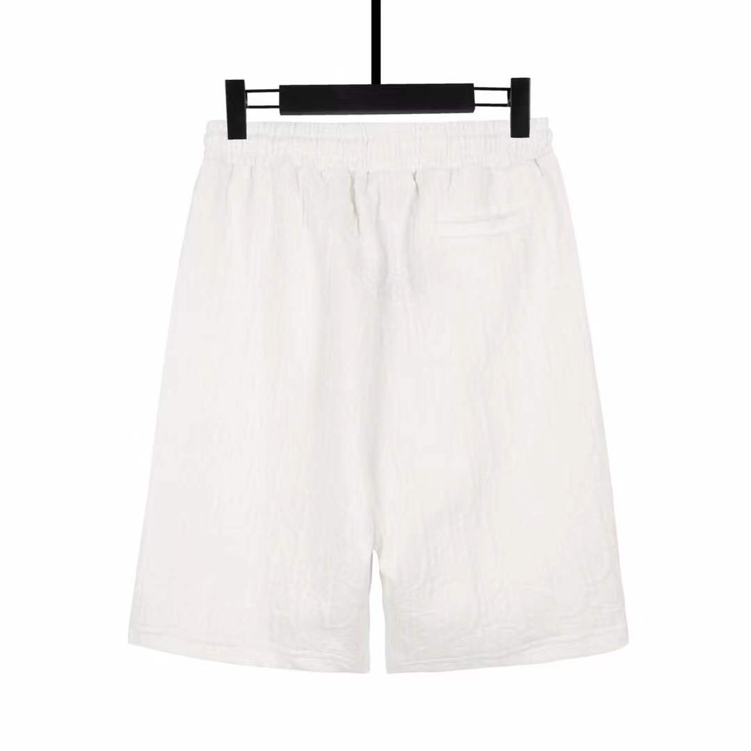Dolce & Gabbana logo-embroidered Bermuda shorts featuring a drawstring waist and side zip pockets.