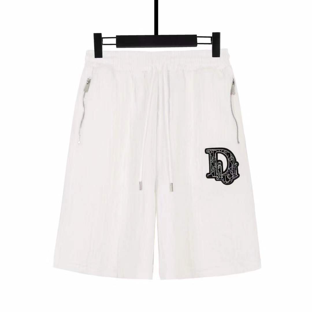 Dolce & Gabbana logo-embroidered Bermuda shorts featuring a drawstring waist and side zip pockets.