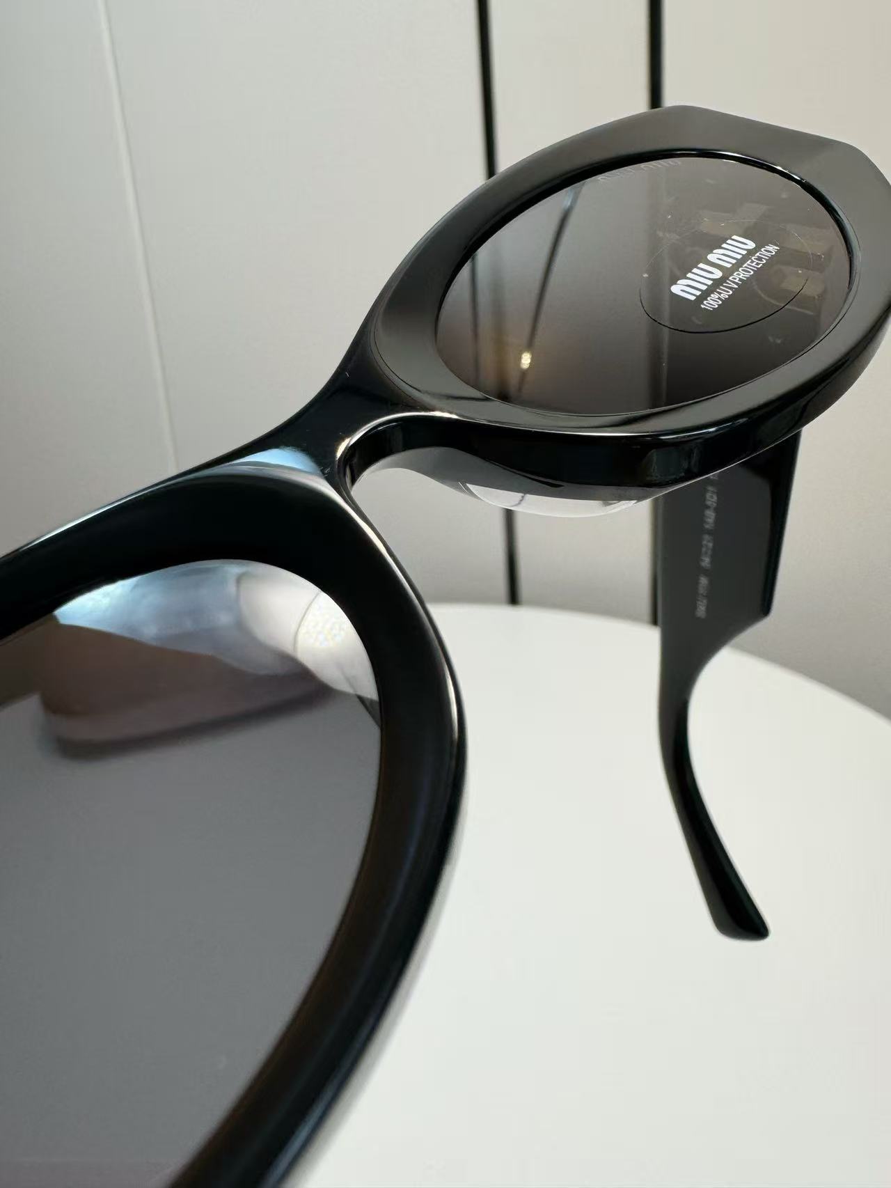 Miu Miu Eyewear Miu Glimpse oval-frame Sunglasses | Black