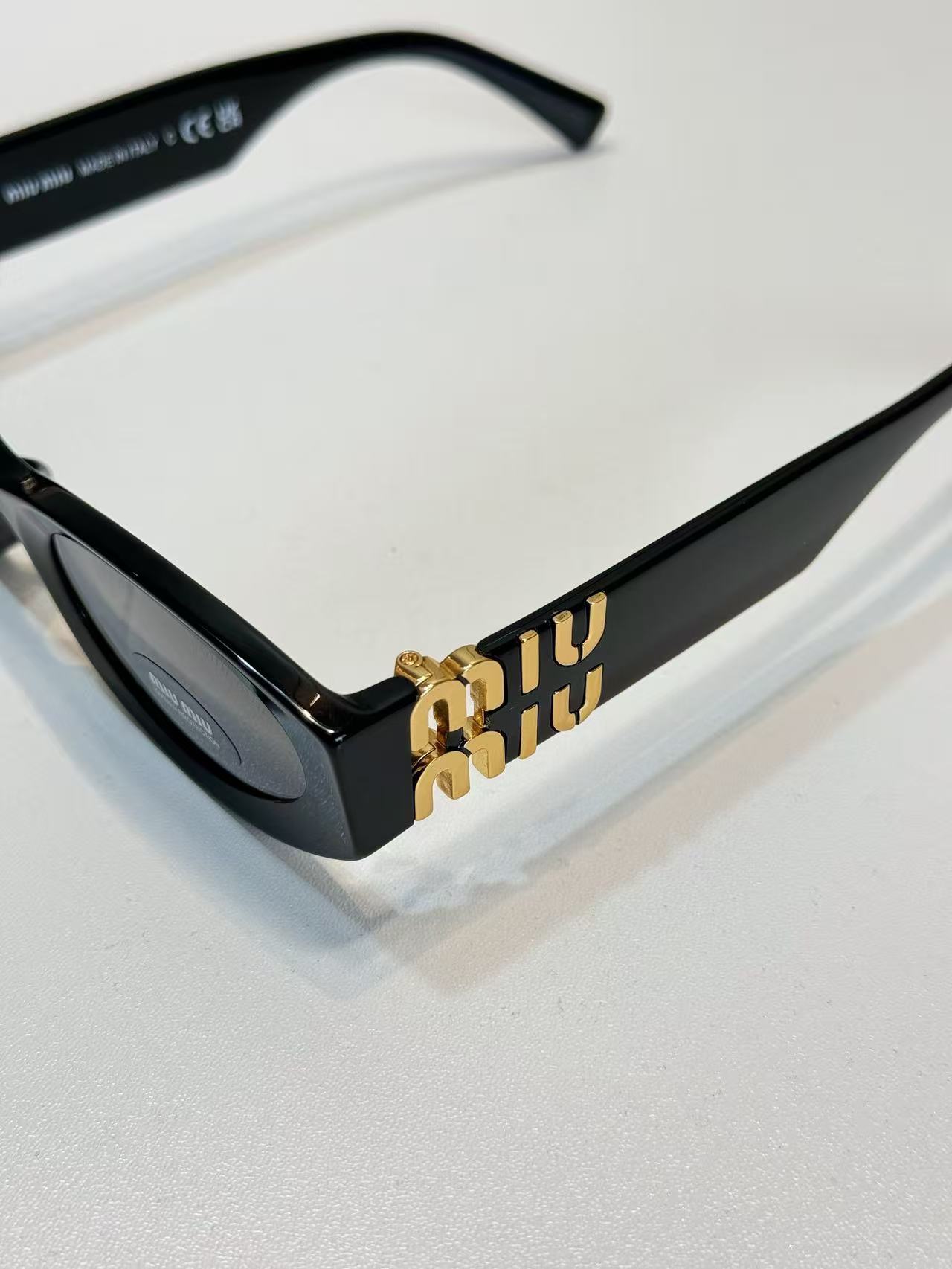 Miu Miu Eyewear Miu Glimpse oval-frame Sunglasses | Black