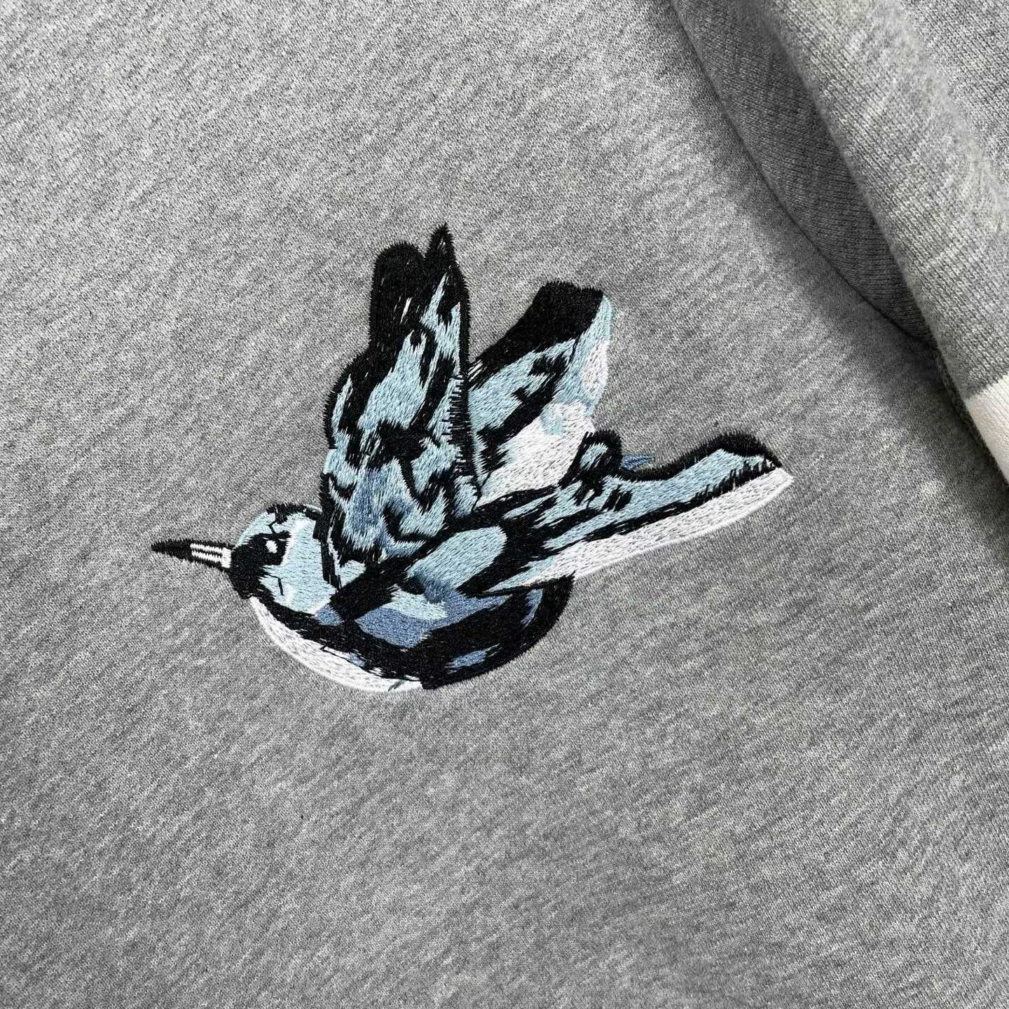 Thom Browne grey cotton sweatshirt featuring bird embroideries and the brand's signature four-bar stripes