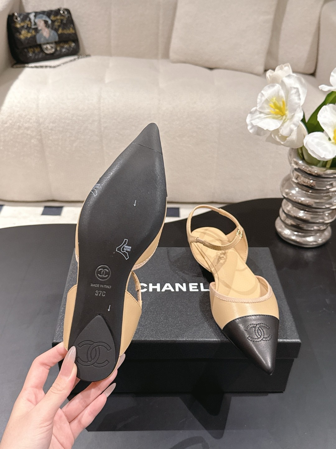 Chanel Beige and Black Leather Cap Toe D'Orsay Flats feature ankle straps and a pointed design.