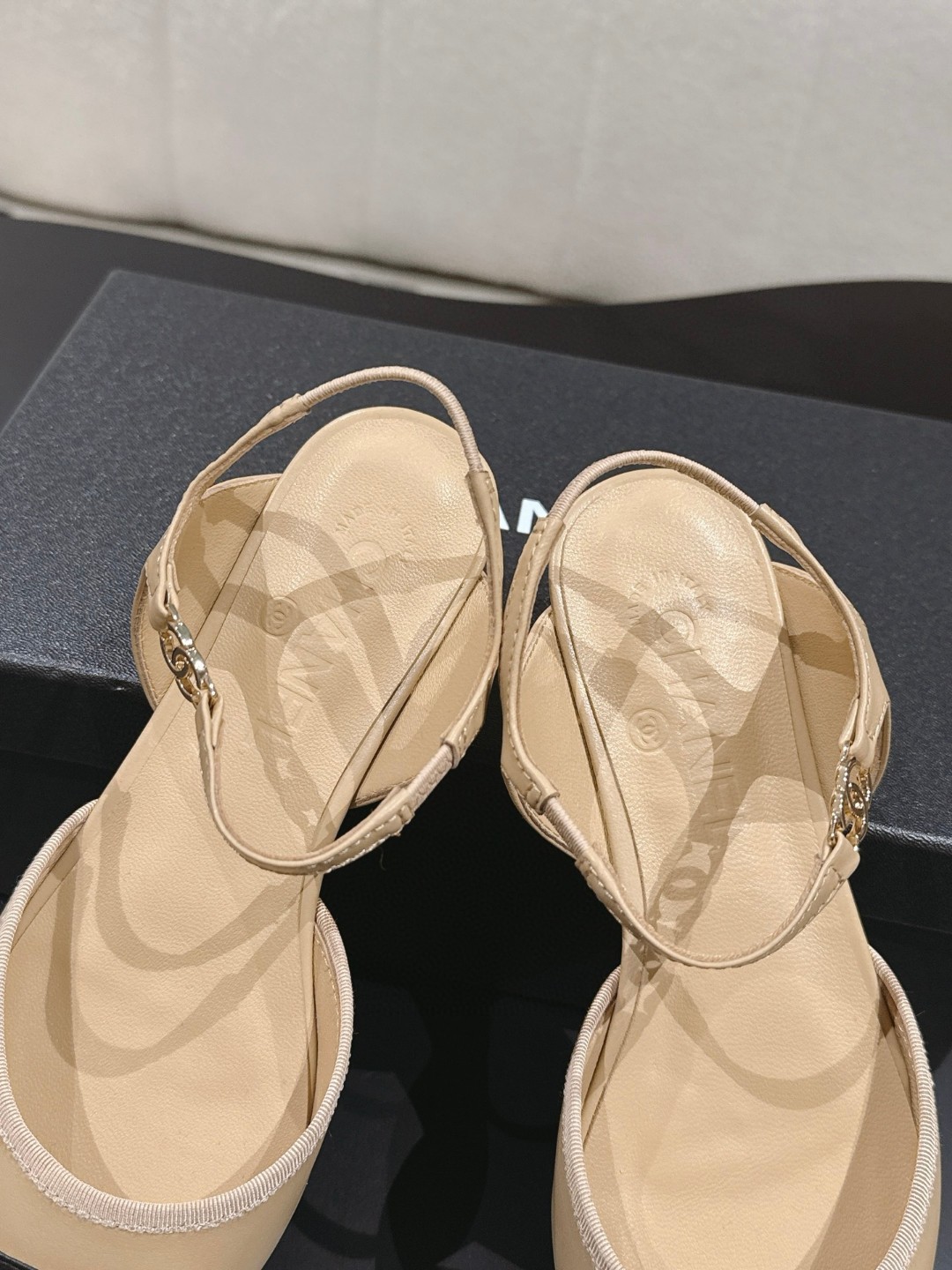 Chanel Beige and Black Leather Cap Toe D'Orsay Flats feature ankle straps and a pointed design.