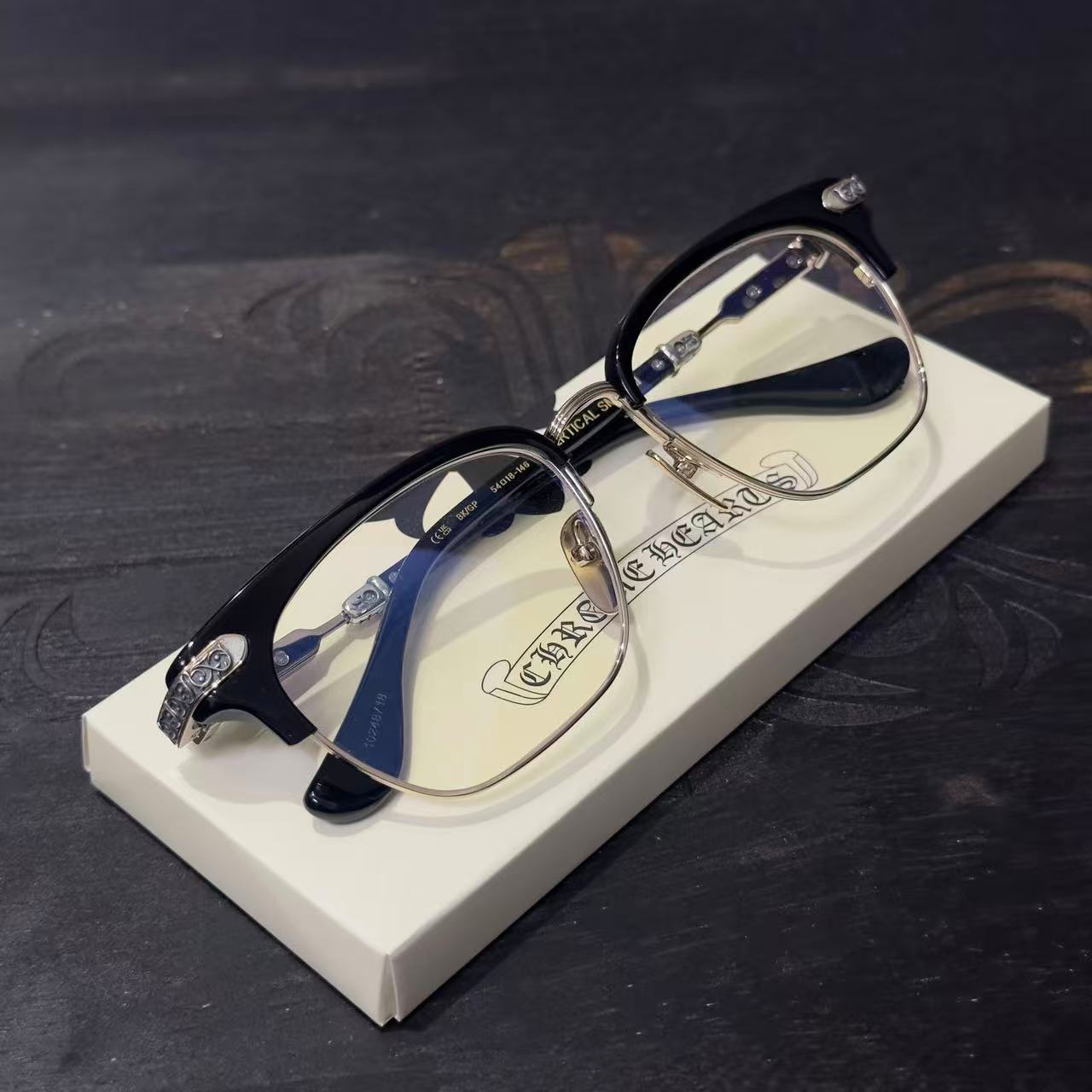 Chrome Hearts BONENNOISSEUR II spectacles featuring a black and brushed silver design.