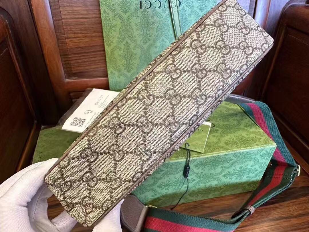 Gucci Ophidia GG Small Handbag in beige and ebony Supreme canvas features leather trim, the iconic green and red Web stripe, and a chain strap