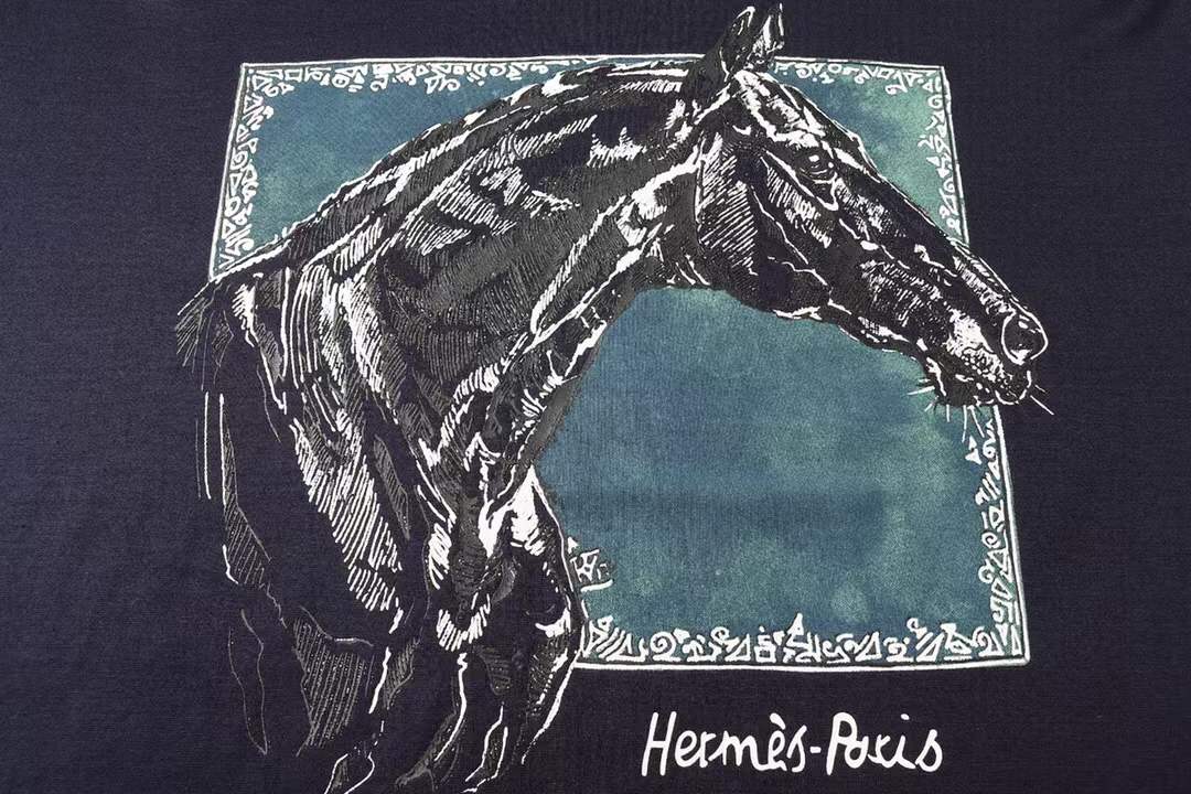 Hermès "Paris" cotton navy blue t-shirt featuring a detailed metallic-style horse graphic print.