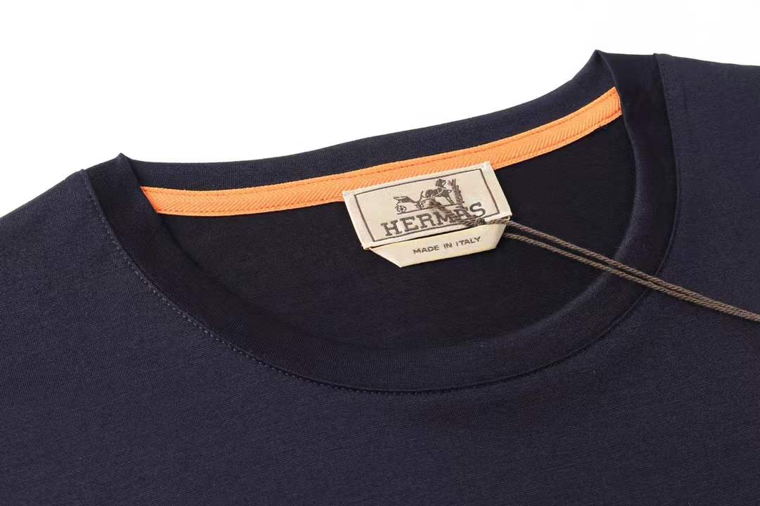 Hermès "Paris" cotton navy blue t-shirt featuring a detailed metallic-style horse graphic print.