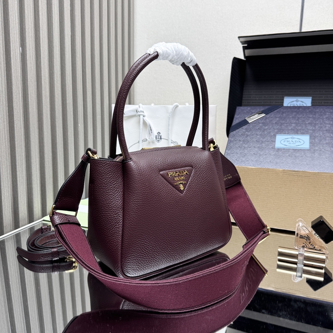 Prada Small Leather Tote Bag, featuring two rolled top handles and an adjustable detachable shoulder strap