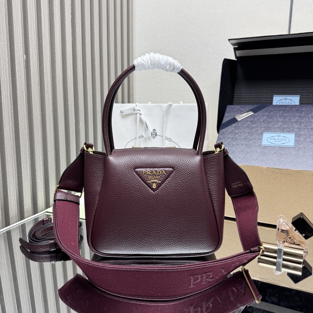 Prada Small Leather Tote Bag, featuring two rolled top handles and an adjustable detachable shoulder strap