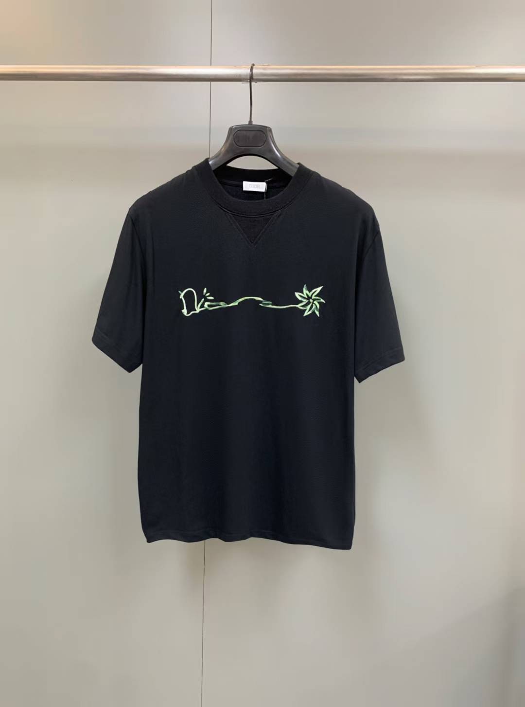 Dior x Cactus Jack Oversized T-shirt in black part of a collaboration featuring embroidered branding on the chest