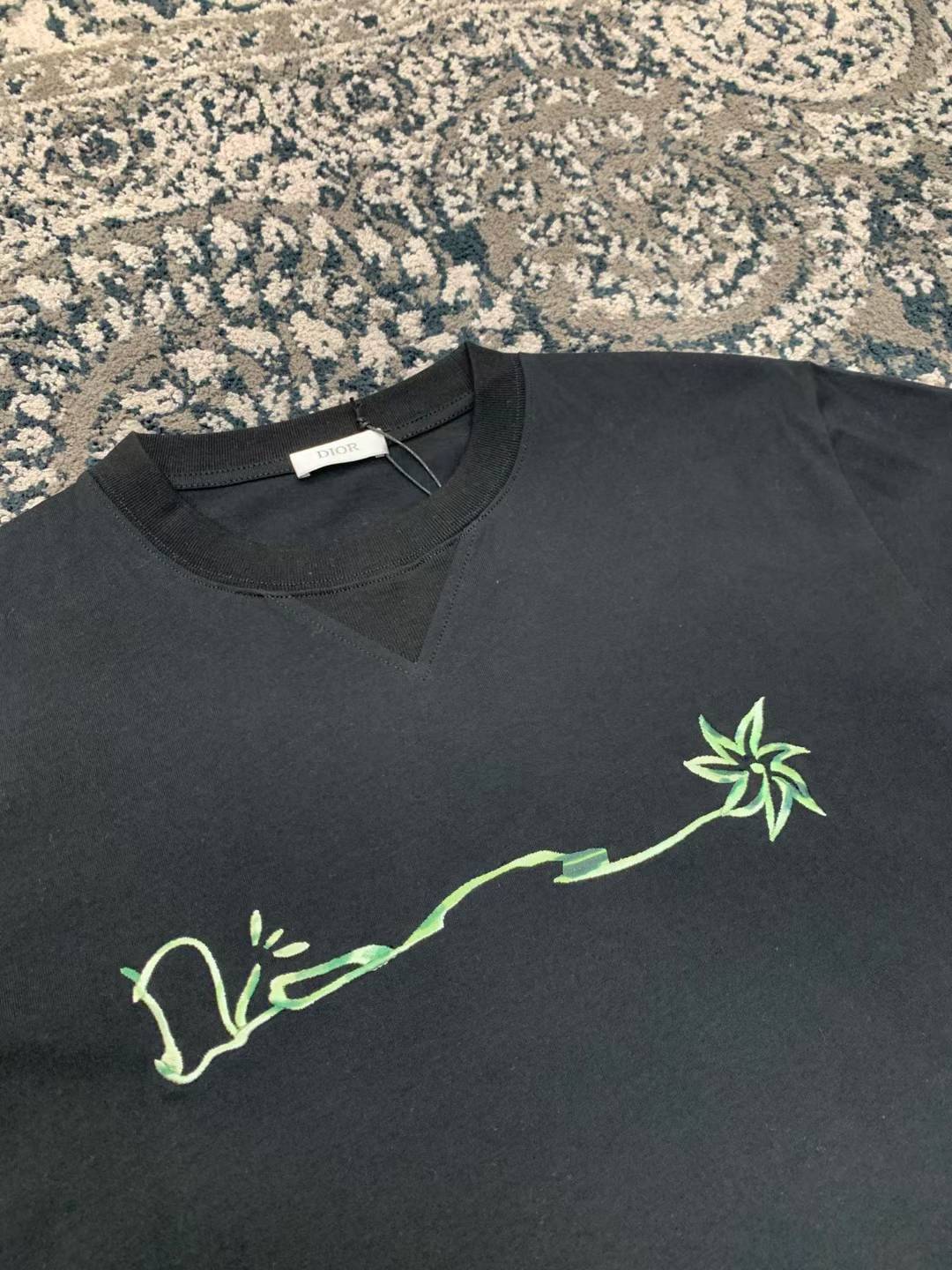 Dior x Cactus Jack Oversized T-shirt in black part of a collaboration featuring embroidered branding on the chest