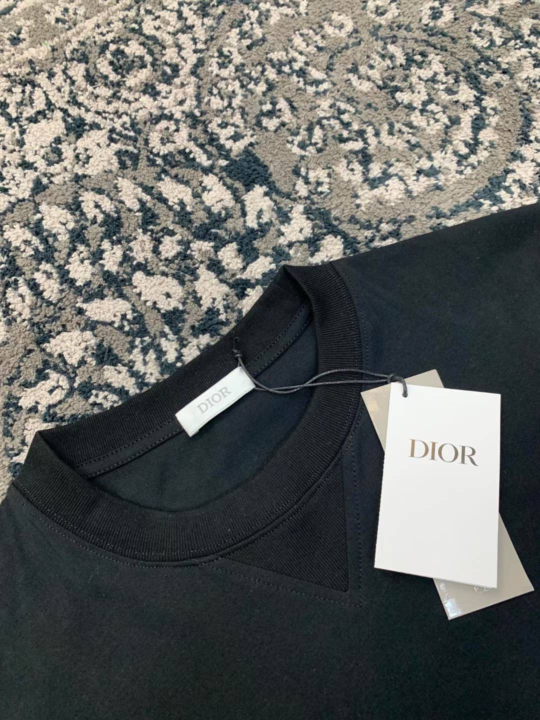 Dior x Cactus Jack Oversized T-shirt in black part of a collaboration featuring embroidered branding on the chest
