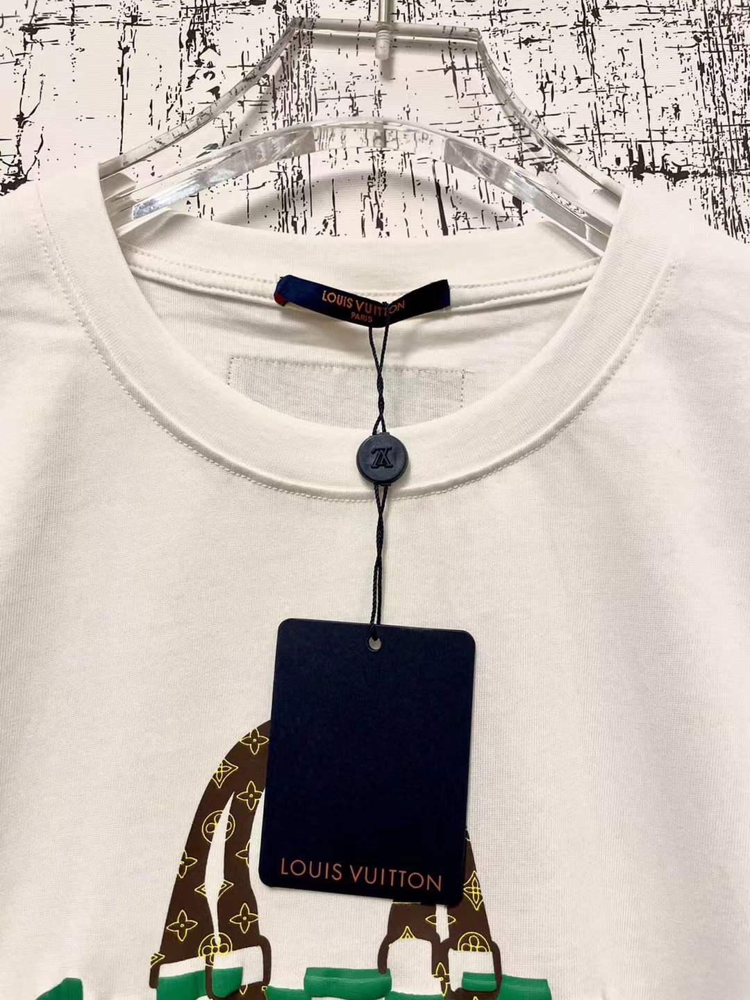 LV graphic t-shirt featuring a green and white Damier check patterned handbag design on the front