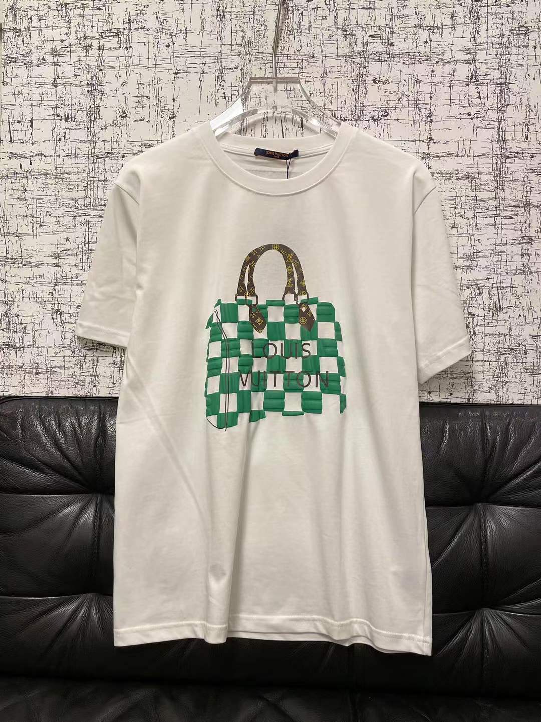 LV graphic t-shirt featuring a green and white Damier check patterned handbag design on the front