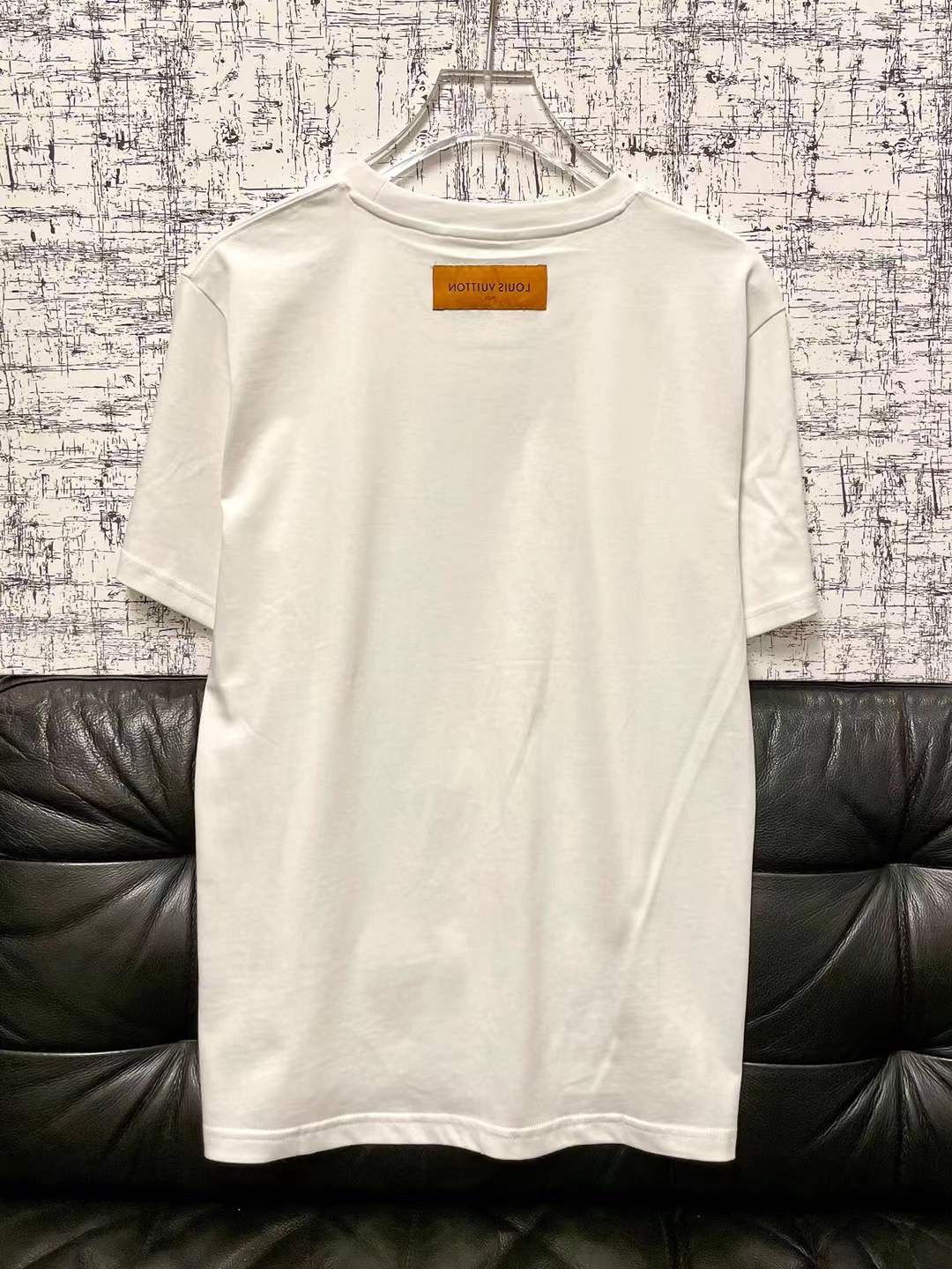 LV graphic t-shirt featuring a green and white Damier check patterned handbag design on the front