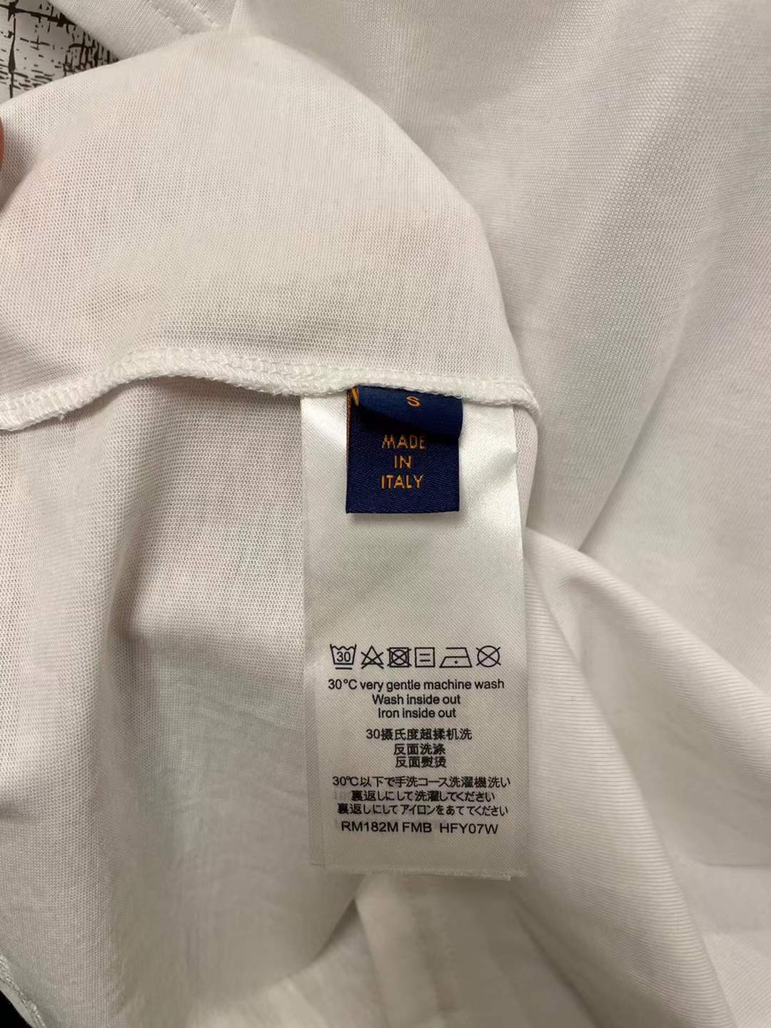 LV graphic t-shirt featuring a green and white Damier check patterned handbag design on the front