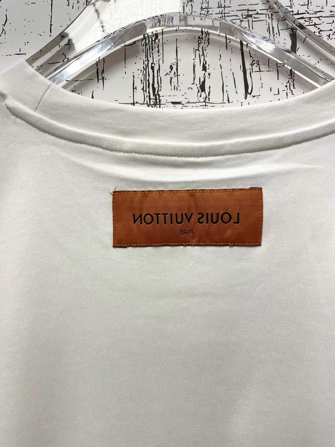 LV graphic t-shirt featuring a green and white Damier check patterned handbag design on the front