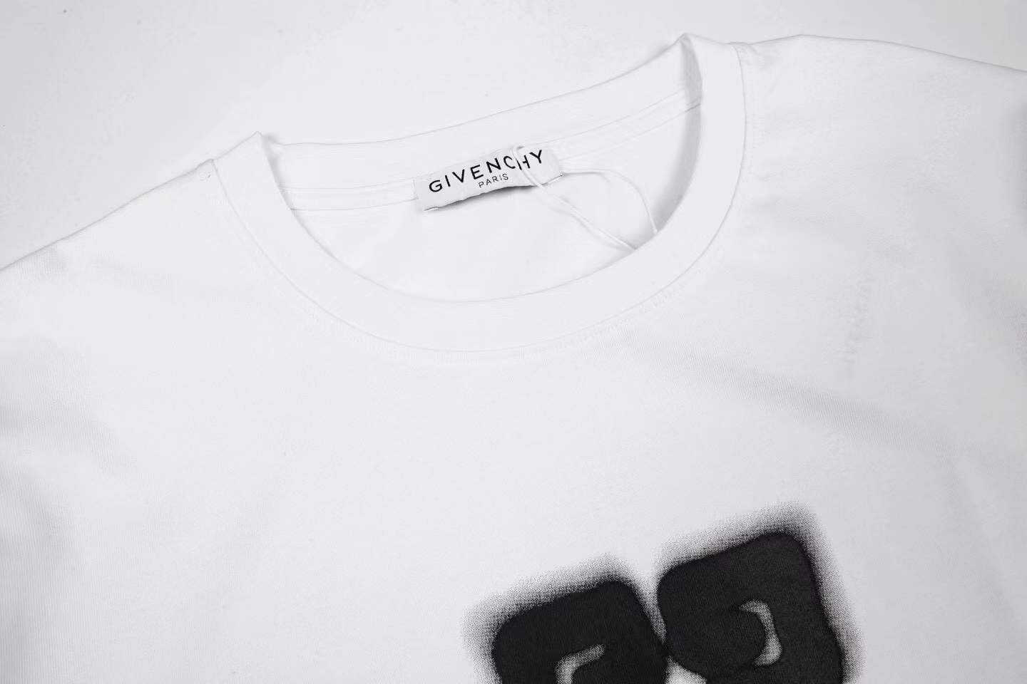 givenchy white cotton t-shirt featuring a Givenchy 4G logo graphic on the front