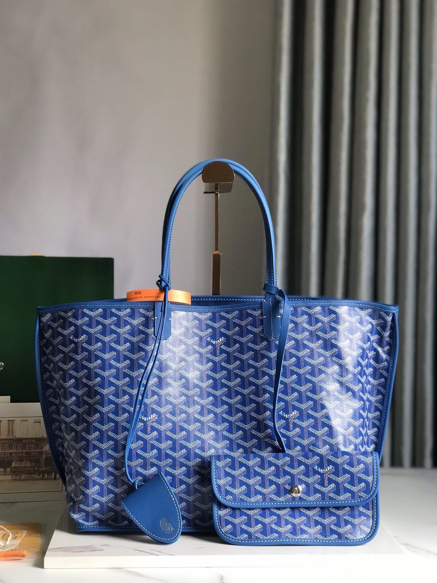 Goyard Saint Louis PM tote bag, featuring the brand's iconic chevron-patterned coated canvas and a matching removable pouch