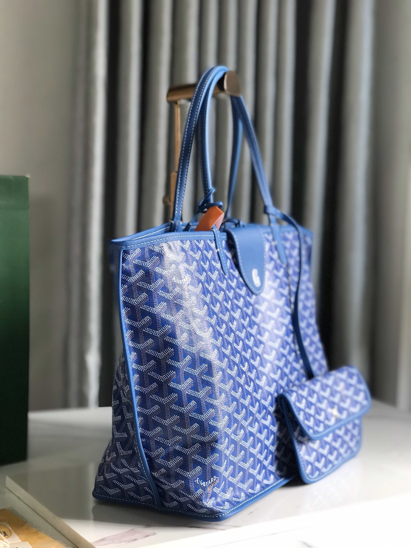 Goyard Saint Louis PM tote bag, featuring the brand's iconic chevron-patterned coated canvas and a matching removable pouch