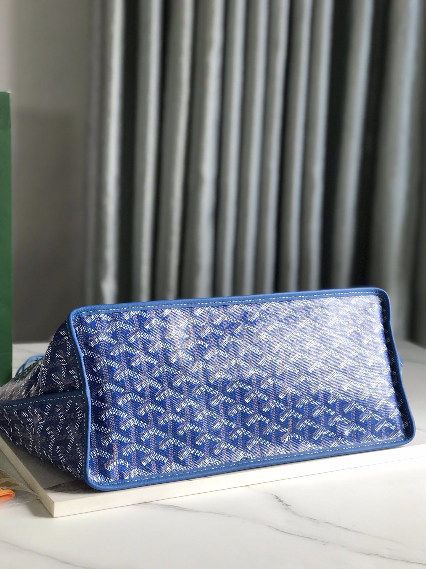 Goyard Saint Louis PM tote bag, featuring the brand's iconic chevron-patterned coated canvas and a matching removable pouch