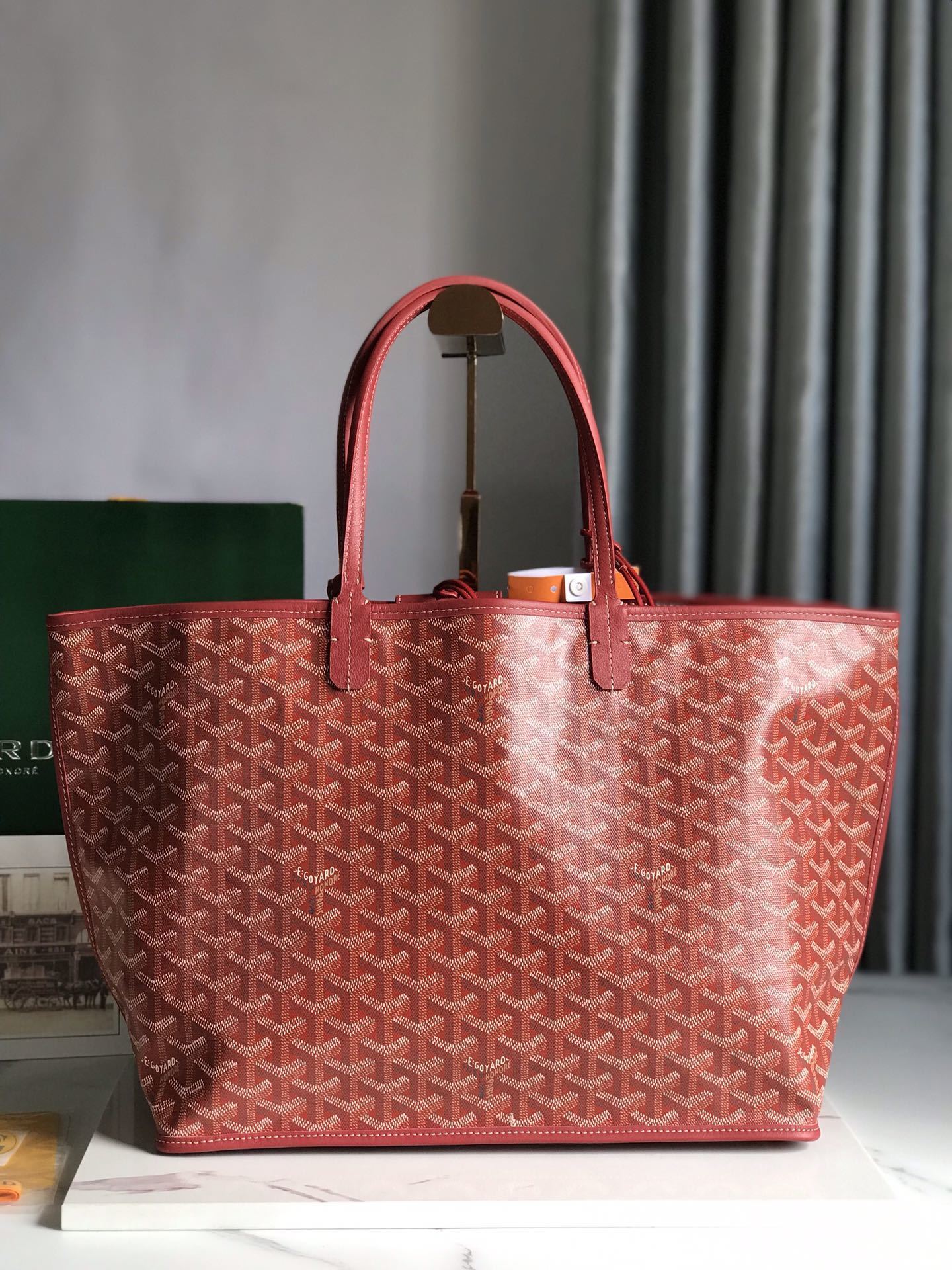 Goyard Saint Louis PM tote in red, featuring the iconic chevron-patterned Goyardine canvas