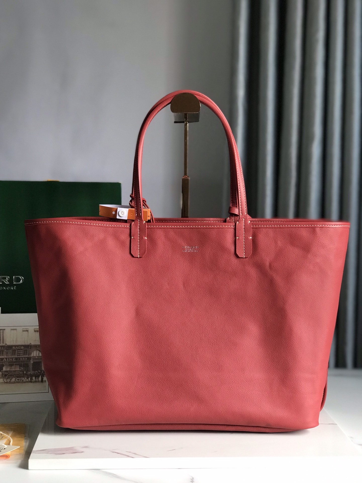 Goyard Saint Louis PM tote in red, featuring the iconic chevron-patterned Goyardine canvas