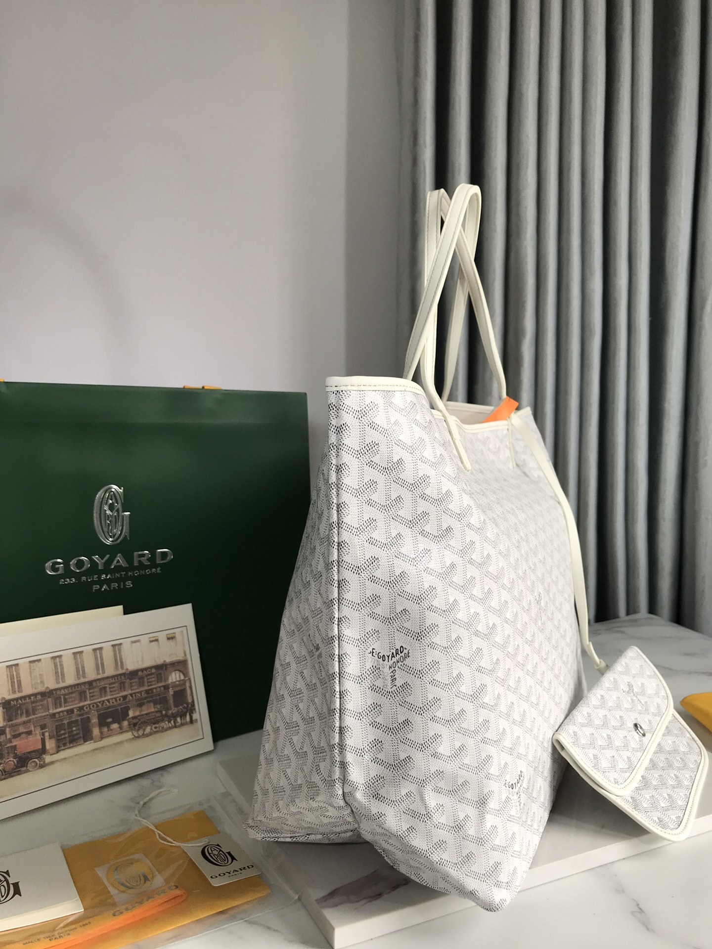 Goyard Saint Louis PM tote bag featuring the brand's signature Goyardine canvas and a matching removable pouch
