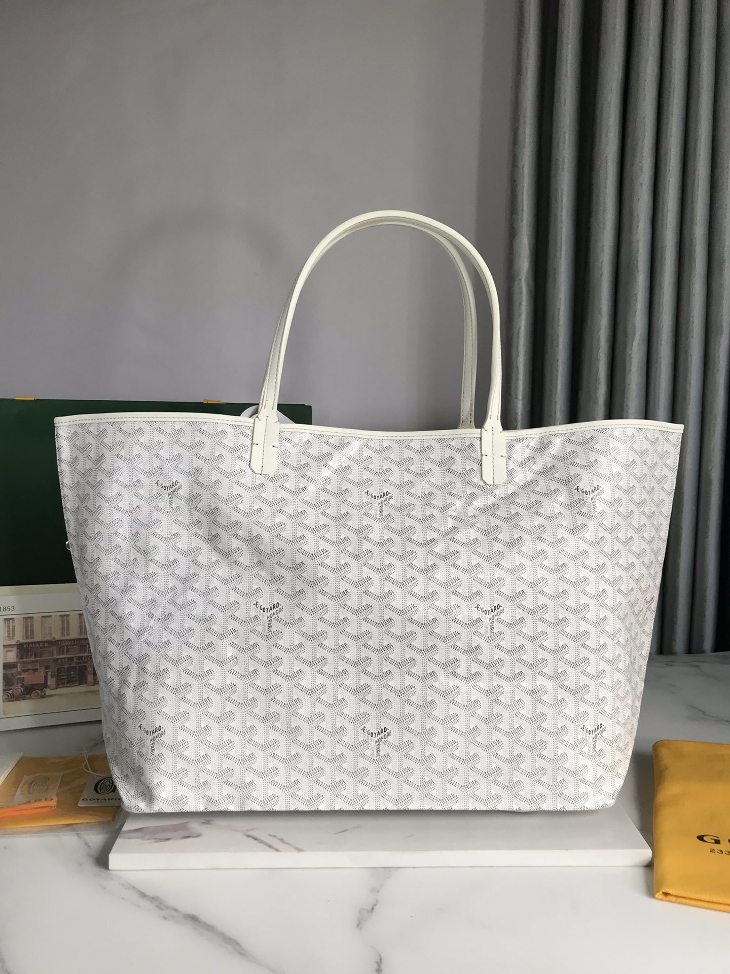 Goyard Saint Louis PM tote bag featuring the brand's signature Goyardine canvas and a matching removable pouch